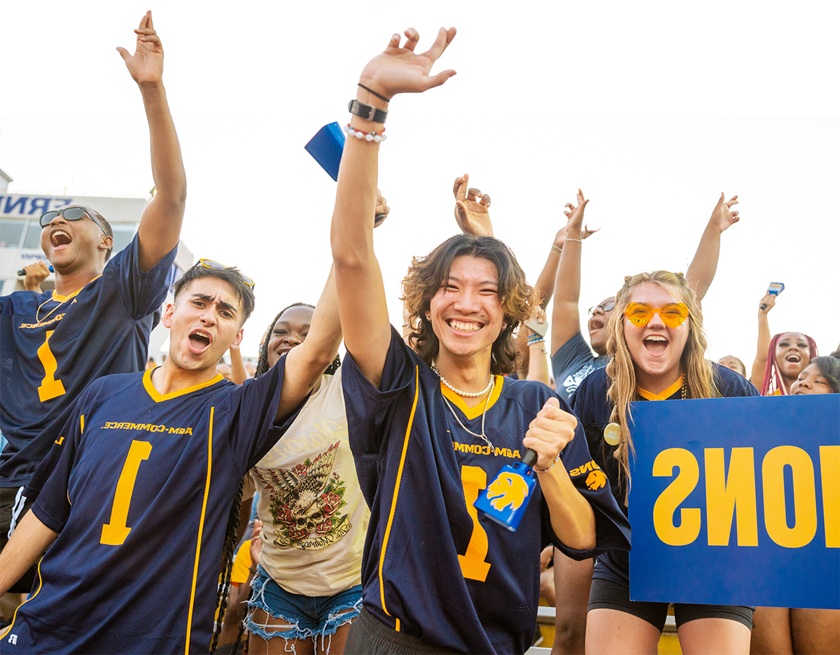 Spirited students cheering at the football stadium